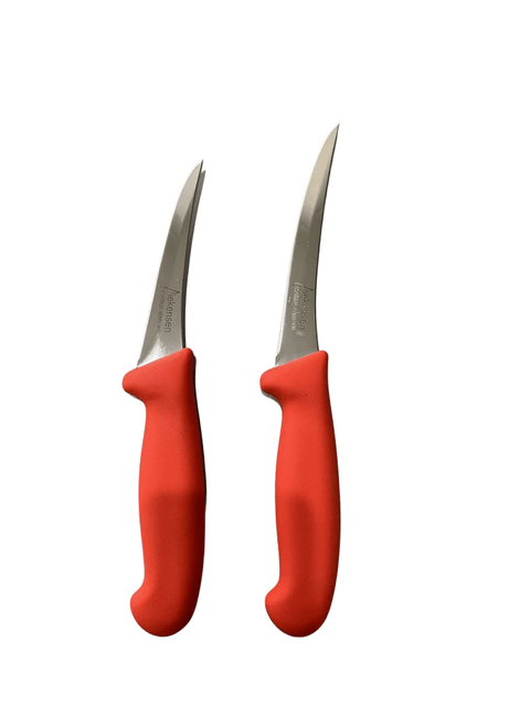 a pair of red scissors sitting next to each other