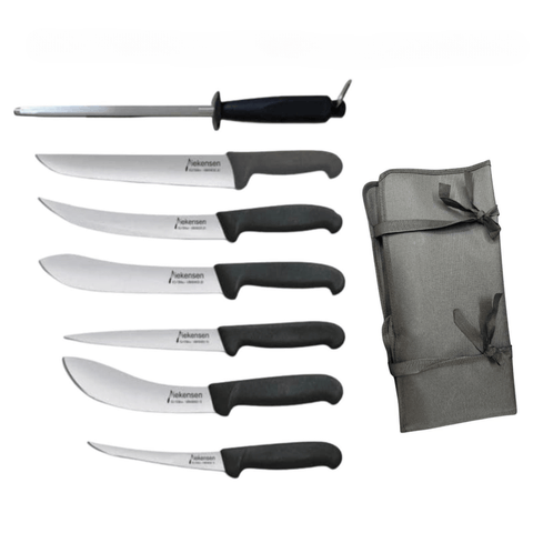 a set of knives sitting next to a napkin